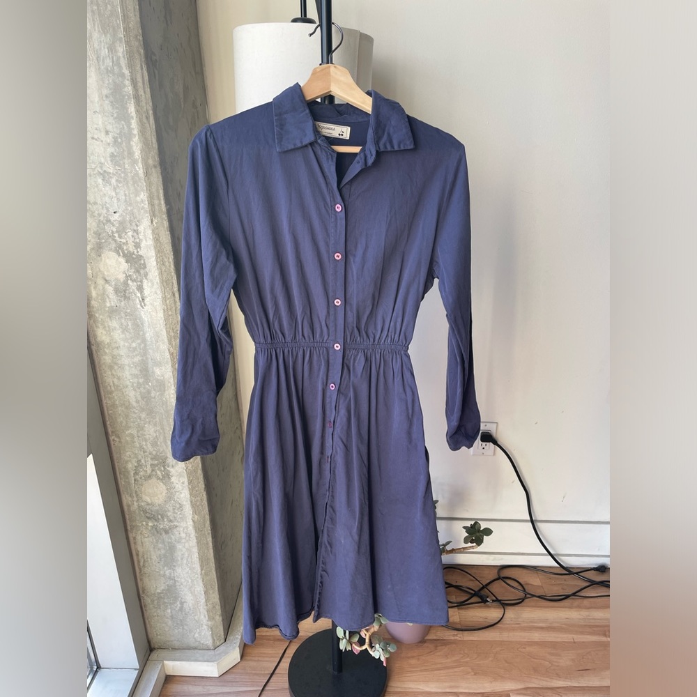 Navy shirt dress with front buttons and cinched waist.